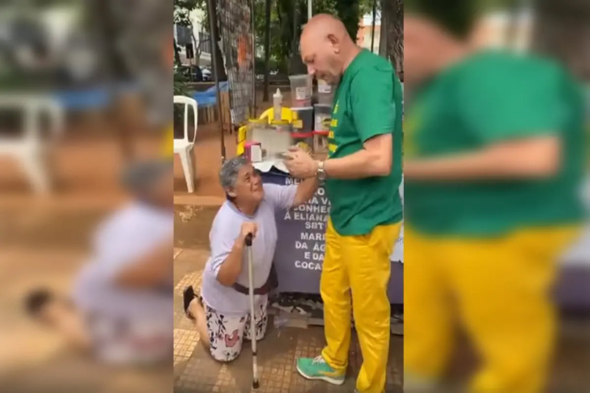 Mulher se ajoelha em agradecimento a Luciano Hang