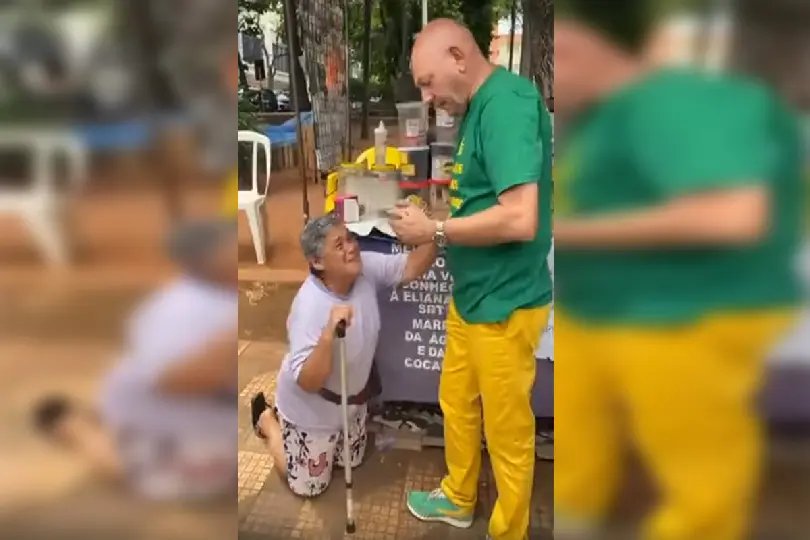 Mulher se ajoelha em agradecimento a Luciano Hang